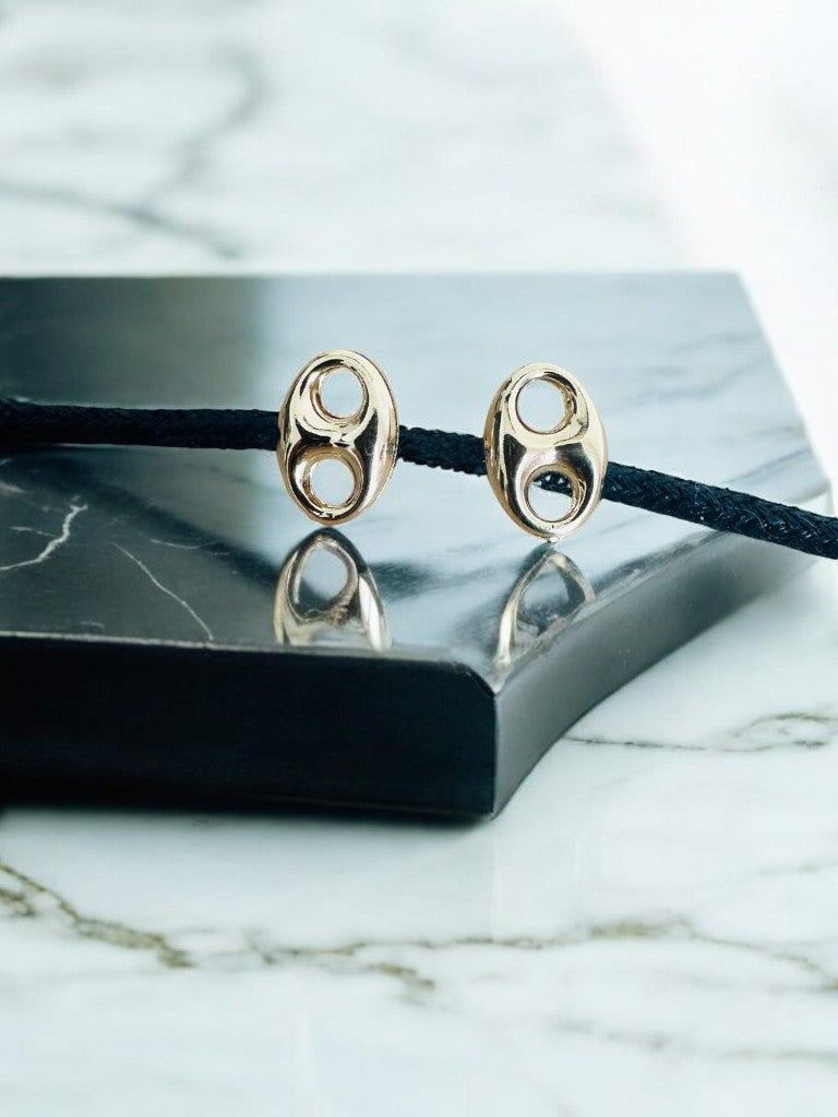 Topos Gucci en oro laminado 18k