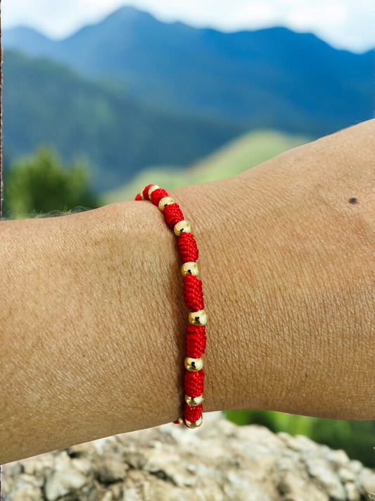 Pulsera tejida con balines en oro laminado 18k