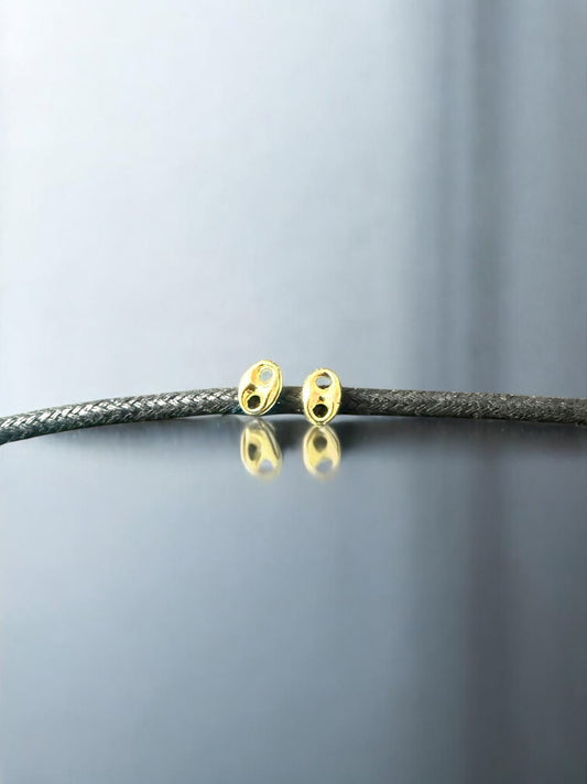 Topo Gucci pequeño en oro laminado 18K
