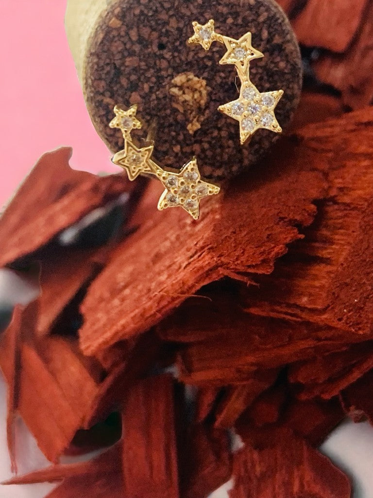 Topos estrella fugaz con circones en oro laminado 18k