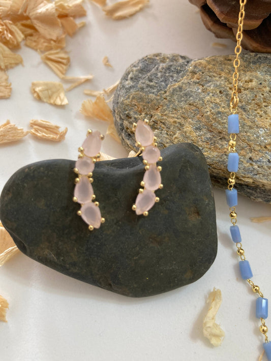 Set de collar y aretes maxitopos con piedras de color rosa